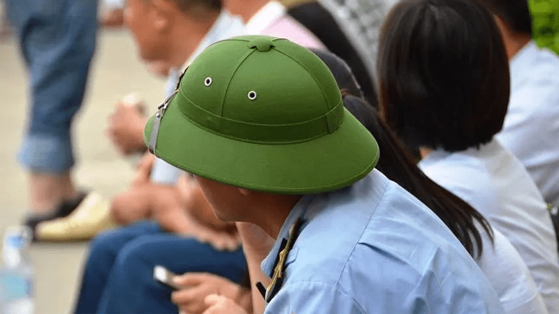 越南男子为何戴绿色帽子