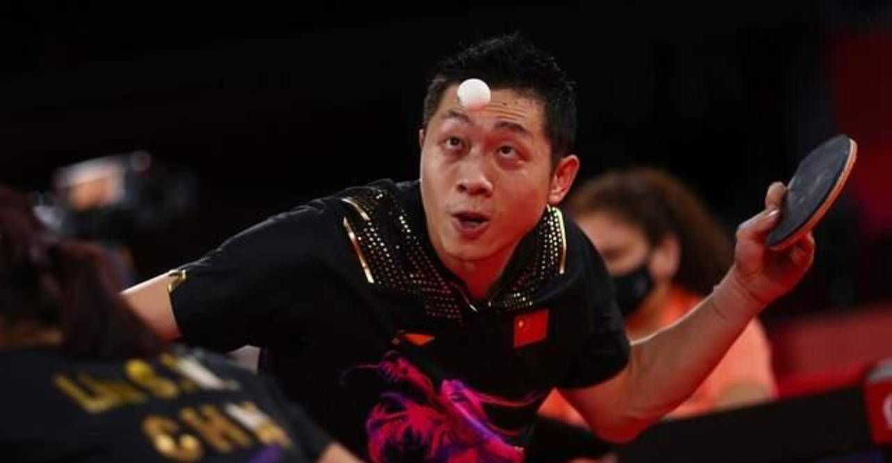 状态的东京奥运会乒乓球男团冠军许昕,在与羽毛球奥运会男单亚军谌龙