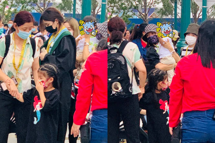戴帽抱|章子怡一家游玩被偶遇！她穿黑裙戴帽抱娃变保姆，儿子眼睛像汪峰