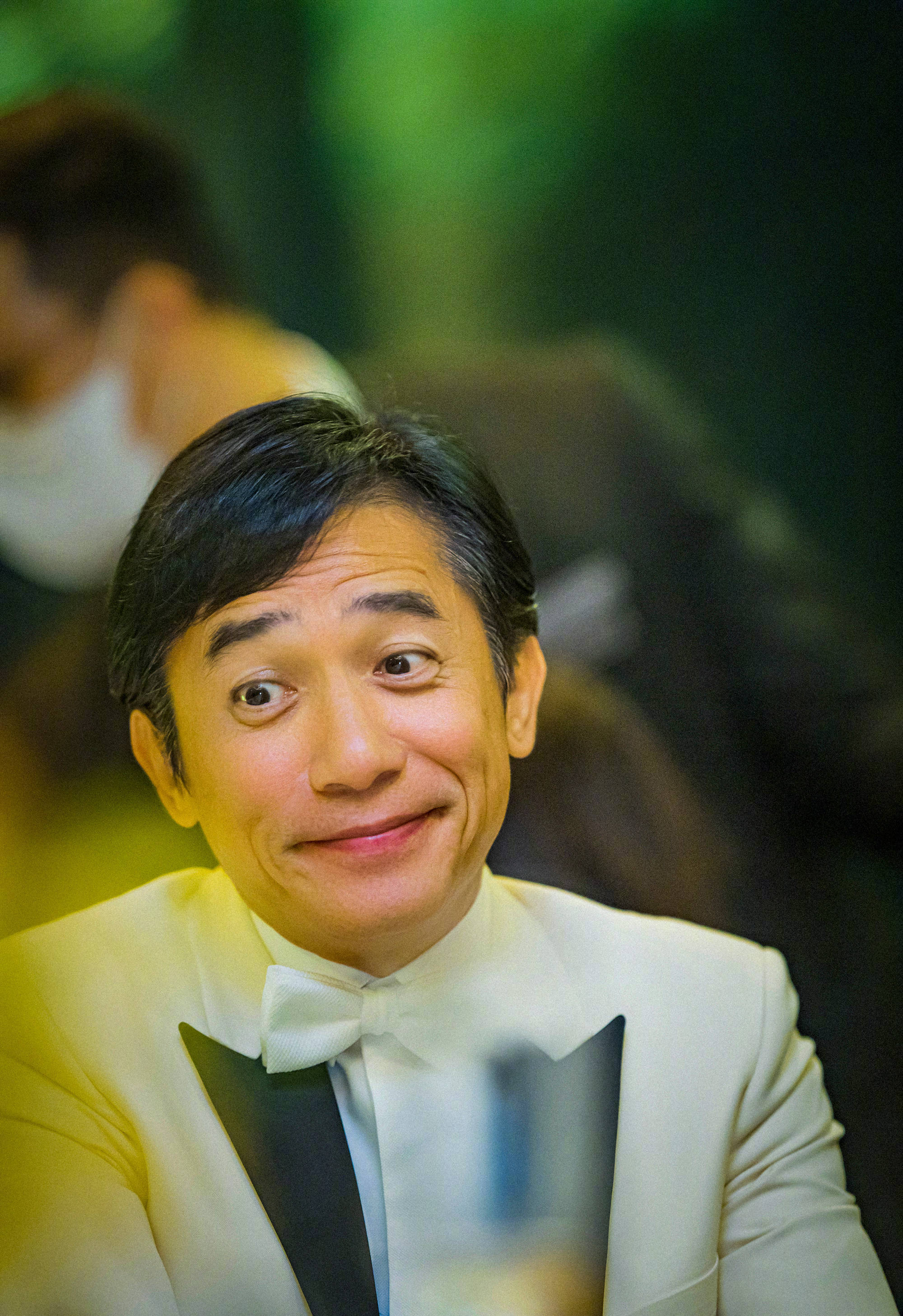 出席第16届亚洲电影大奖红毯的梁朝伟、刘嘉玲夫妇……