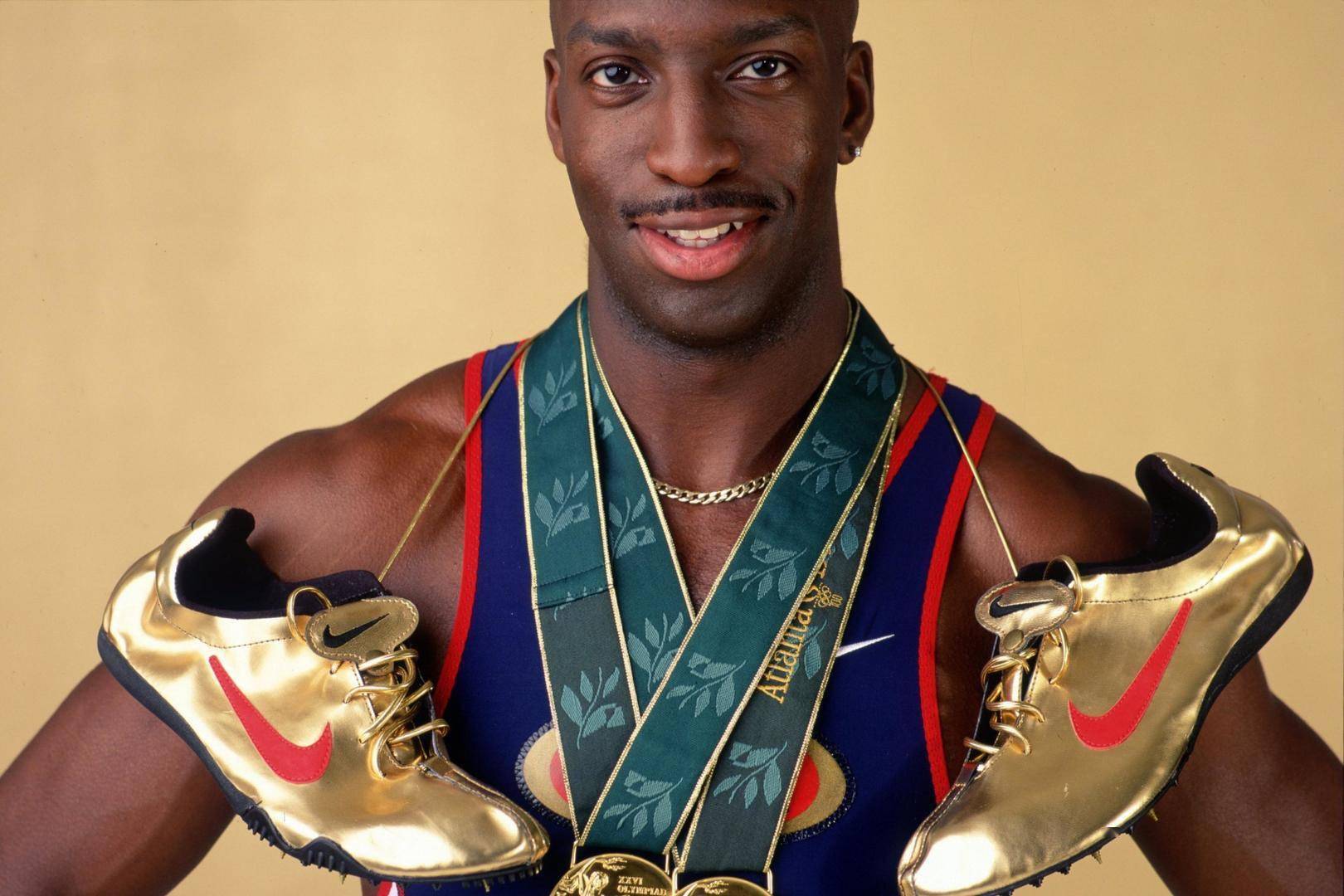 大运人物|只拿金牌的"阿甘"迈克尔·约翰逊